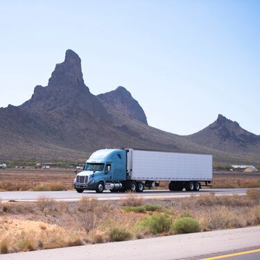 Nogales Cross Border Shipping Blue Semi Truck On Highway